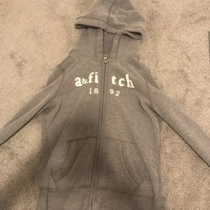 Grey sweatshirt with white lettering